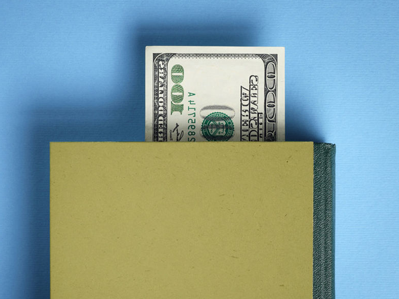 Image of wallet with $100 dollar bill sticking out 